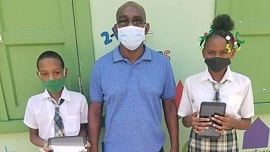 Students Holding Donated Tablets