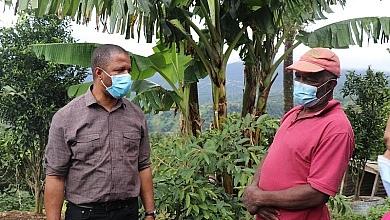 Fidel Grant With Farmer