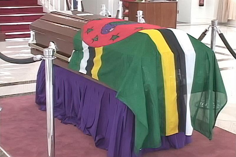 Coffin covered by Dominica Flag