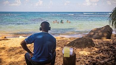 Man Looking At Children in Water Beach