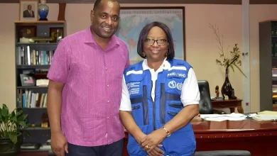 Hon. Roosevelt Skerrit with Dr. Carissa F. Etienne