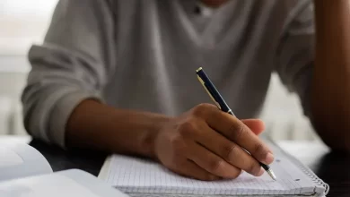 Essay Male Student Writing
