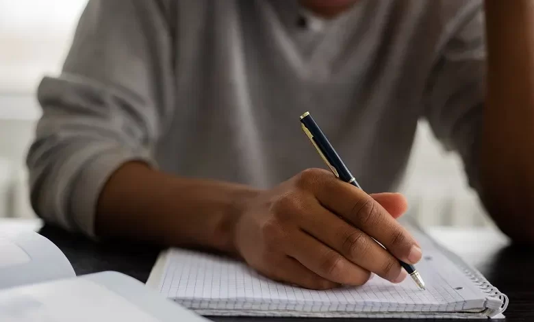 Essay Male Student Writing