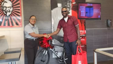 Ronald Charles with KFC Dominica Staff