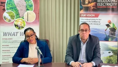 Mr. Kase (right) addressses news conference flanked by IRC's Communications Specialist Edona Jno Baptiste