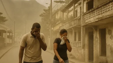 Three people cover their faces from Saharan dust in a rural Dominican village