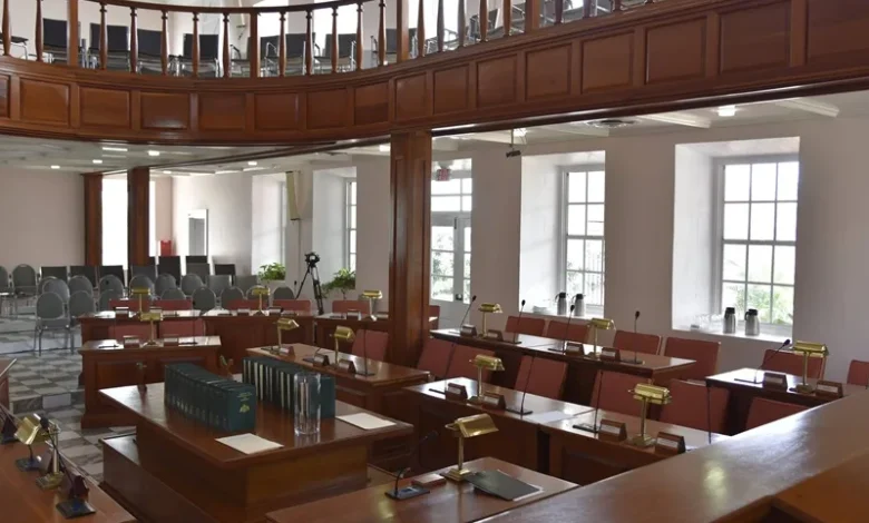 Interior of the House of Assembly in Dominica showing parliamentary seating and desks