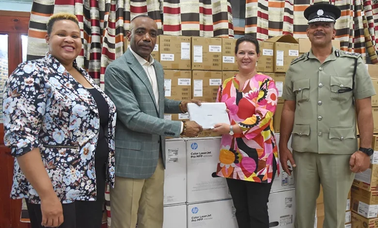 Minister for National Security and Legal Affairs, Hon. Rayburn Blackmoore and his Team Stands with Deputy Resident Representative for the UNDP, Stephanie Ziebell