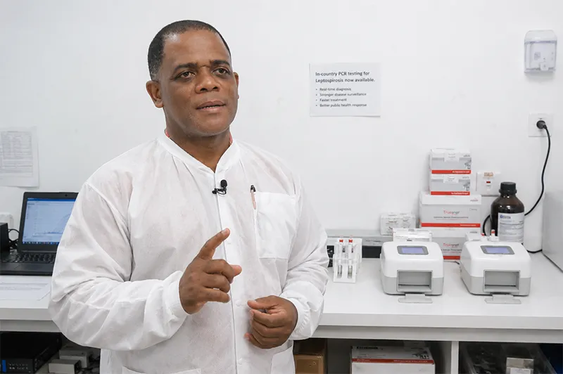 Laboratory Superintendent Eric Carbon giving an interview inside the National Medical Laboratory in Dominica about the introduction of in-country PCR testing for leptospirosis.