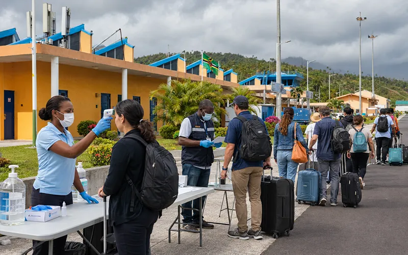 Health officers screening passengers outside a Dominican airport as part of Ebola preparedness measures at ports of entry.