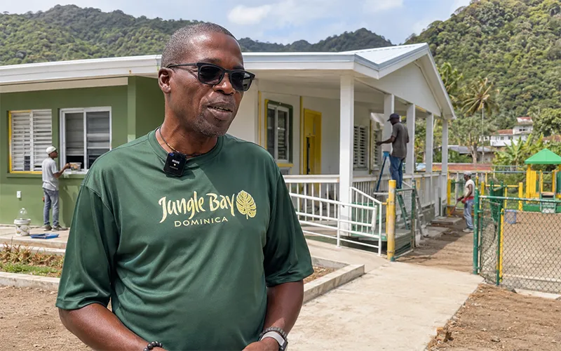 Jungle Bay Managing Director Sam Raphael gives an interview outside the nearly completed Soufrière Preschool in Dominica. - not the real School